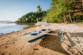 Bangka boat on sandy remote beach with golden sunset light. El Nido bay. Philippines Royalty Free Stock Photo