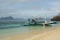 A bangka, the traditional filipino boat, moored at Seven Commandos beach. Bacuit archipelago. El Nido. Palawan. Philippines