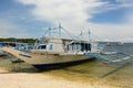 A bangka, the traditional filipino boat, moored on the shore. Tulubhan beach. Boracay Island. Western Visayas. Philippines Royalty Free Stock Photo