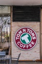 TOM N TOMS coffee house with sign on wall in Bangkok, Thailand