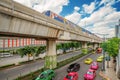 Bangkok City Transportation System. BTS with a taxi-filled road On the day that the sky was cloudy