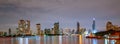 Bangkok cityscape of river front modern building in Thailand. Beautiful night scene of river,downtown building, sky and clouds. Royalty Free Stock Photo