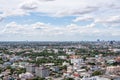 The Bangkok cityscape from skyscraper view with clouds and blue sky