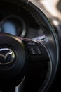 BANGKOK - Dec 4, 2021 : Close-up view of a cruise control on the steering wheel for a Mazda CX-5, Skyactiv technology, 2000cc.