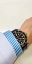 Rolex Submariner no date model on wrist in hospital office