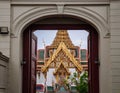 Bangkok Grand Palace `Dusit Maha Prasat` throne hall seen through gate Royalty Free Stock Photo