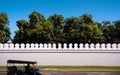 Bangkok Grand Palace wall and Tuk Tuk in front Royalty Free Stock Photo
