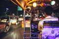 BANGKOK - JUNE 10, 2015: An unidentified tuktuk driver stuck in traffic