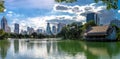 Bangkok, Lumpini Park - picturesque city view, lake and skyscrapers Royalty Free Stock Photo