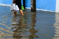 BANGKOK - May 25: A people evacuates from the flooded area at Ba