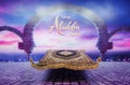 A photo of movie standee of a magic carpet in front of a twilight scene in Aladdin to promote the movie Aladdin 2019 in cinema