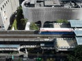 BANGKOK - October 31,2019: Birds eye view of a BTS Skytrain on elevated rails in Phloen Chit district,condominiums and hotels in b