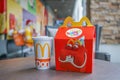 BANGKOK - OCTOBER 10, 2 : Happy meal set ,in soft focus, with blurred Ronald Mcdonald at McDonald`s restaurant on October 10, 2017