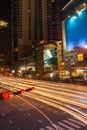 Bangkok rush hour. Intersection, commuter traffic travels at night. Colorful night traffic in the city. The car light trail. Royalty Free Stock Photo