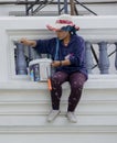 Bangkok, Tahiland - 2019-03-01 - Woman paints a balcony for restoration of Grand Palace Royalty Free Stock Photo