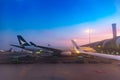 BANGKOK, THAILAND - April 10, 2019: Air plane parking at airport ramp service for commercial air plane after landing in sunrise / Royalty Free Stock Photo