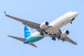 Aircraft or Plane of Garuda Indonesia Airways on the sky landing to Suvanabhumi airport.