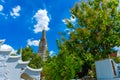 Bangkok, Thailand - April 17, 2019: In the enclosure of the Wat Arun, the temple of the Reclining Buddha on sky background.