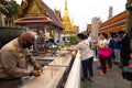 BANGKOK, THAILAND - APRIL 6, 2018: The Grand Palace - Chakri Day - Decorated in gold and bright colors where buddists go