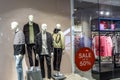 BANGKOK THAILAND, April 4, 2017: Large red Sale letters on a glass wall obstruct a view inside the popular clothing H & M store