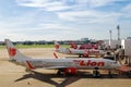 Bangkok, Thailand - April 13, 2020 : Lion Air and AirAsia airplanes in parking bay at airport terminal after flight cancellation