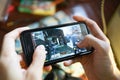 A man playing Call of Duty Mobile game on iPhone 7. Royalty Free Stock Photo