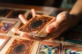 A man playing Yu-Gi-Oh trading card game.