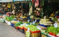 BANGKOK, THAILAND - APRIL 1, 2017: Row of tropical vegetables and fruits with prices at Khlong Toey market