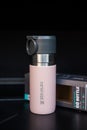 Bangkok, Thailand - April 23, 2022 : Stanley of pink stainless steel thermos travel mug to keep the drink warm or cold