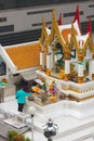 Bangkok, Thailand - April 31, 2014. Man making an offering at Amarindradhiraja shrine in the city of Bangkok