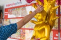Bangkok, Thailand - April, 11, 2021 : Thai people sprinkle water on the Buddha statue on Songkran Day to worship and make wishes