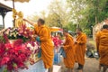 Buddhist Monks sprinkling scented water on the Buddha Image in