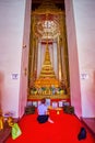 The young lady prays at the Golden Stupain Phra Mondop Shrine of Wat Mahathat temple, on April 23 in Bangkok, Thailand Royalty Free Stock Photo