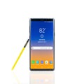 Bangkok, Thailand - Aug 28, 2018: Samsung Galaxy Note 9 smartphone with yellow S-Pen stylus, isolated in white background Royalty Free Stock Photo