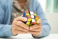 Bangkok, Thailand August 14, 2023 Alzheimer disease AD, Asian elderly woman patient playing Rubik cube game to practice brain