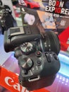 Canon EOS R10 camera with RF-S18-45mm lens sold in stores, new camera, close-up, editorial, ill