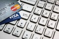 Bangkok, Thailand - August 24, 2017: Close up shot of 2 credit cards VISA and Mastercard on laptop computer with enter button focu Royalty Free Stock Photo