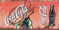 Grunge rusty retro vintage Coca-Cola advertising metal board sign Royalty Free Stock Photo