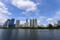 Bangkok, Thailand - August 18, 2018 : Lake Ratchada situated in the Benjakitti Park with modern buildings in the background in Royalty Free Stock Photo