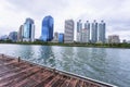 Bangkok, Thailand - August 18, 2018 : Lake Ratchada situated in the Benjakitti Park with modern buildings in the background in Royalty Free Stock Photo