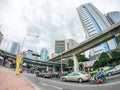 Many car, bus and motorcycle at Intersection at Silom Road, Rama IV Road and Ratchadamri road with Thai-Japanese Friendship Bridge