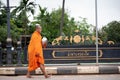 Bangkok, Thailand - August 16, 2017: monks walking on the street to collect alms and offerings in the morning for alms gathering