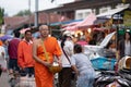 Bangkok, Thailand - August 16, 2017: monks walking on the street to collect alms and offerings in the morning for alms gathering