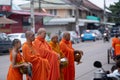 Bangkok, Thailand - August 16, 2017: monks walking on the street to collect alms and offerings in the morning for alms gathering