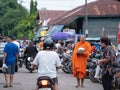 Bangkok, Thailand - August 16, 2017: monks walking on the street to collect alms and offerings in the morning for alms gathering