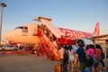 Bangkok, Thailand - August 19, 2015 : Passengers is getting on a Thai Air Asia plane at Don Mueang International Airport