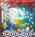 Wall painting of a white rabbit is having a tea party