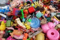 BANGKOK, THAILAND - August 25, 2018 Pile of plastic children`s toys broken or damage are dumped at the 2nd hand shop