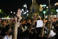 Protesters a three finger salute to show symbolic gestures.