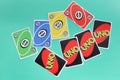 Bangkok, Thailand : August 13, 2023 : A set of colorful Uno game cards on light green background. Royalty Free Stock Photo